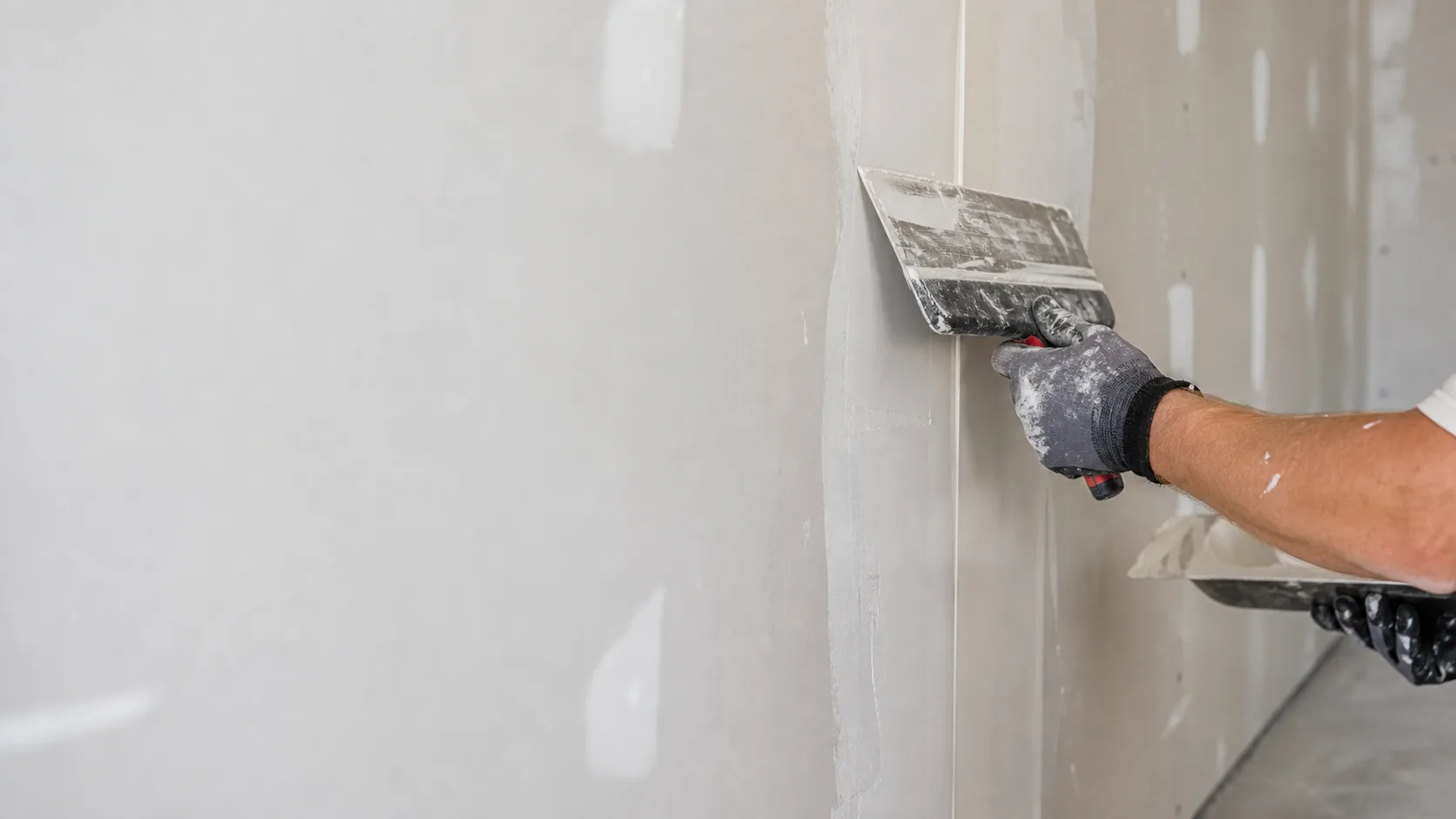 Illustrative view of drywall taping and finishing work.